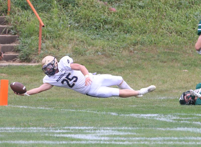 Marquette's Jaxsen Higgins dives for the pylon to score a touchdown over St. Bede during the Homecoming game on Saturday, Sept. 28, 2024 at St. Bede Academy.
