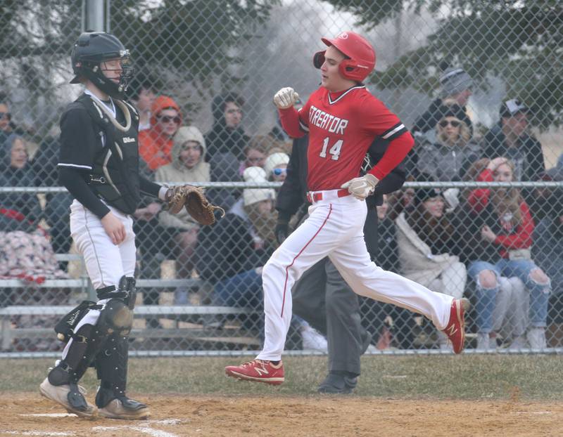 Streator's Cole Martin scores a run as Woodland/Flanagan-Cornell catcher Connor Dodge watches the play on Wednesday, March 15, 2023 at Woodland High School.