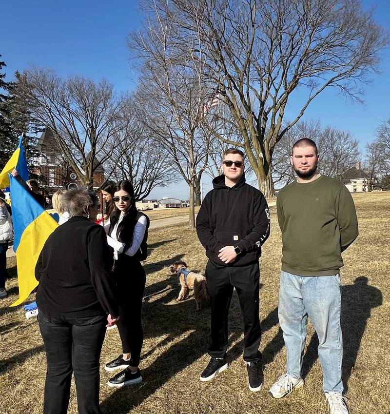 Ukrainians Danylo Ratashnyi and Maksyn Vovk stand with the crowd in support of Ukraine during a vigil in Dixon on March 13, 2025.