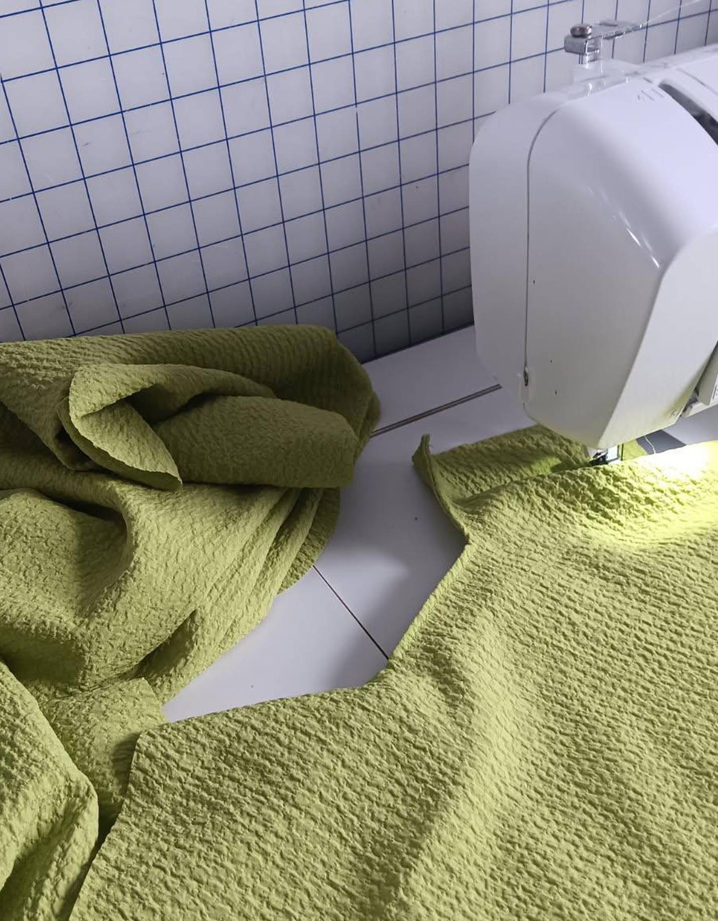 Liz sews a dress for Abigail.