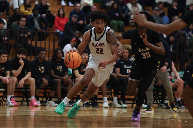 Bolingbrook’s JT Pettigrew drives to the the baseline against Hinsdale South in the 50th Annual Jack Tosh Holiday Classic on Thursday, Dec. 26, 2024 at York High School.