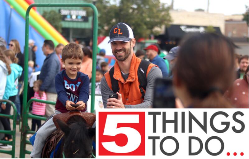 John Lindahl of Cary captures the moment on his phone as his son, Liam, 4, rides a pony during the Johnny Appleseed Festival Saturday, Sept. 24, 2022, in downtown Crystal Lake.