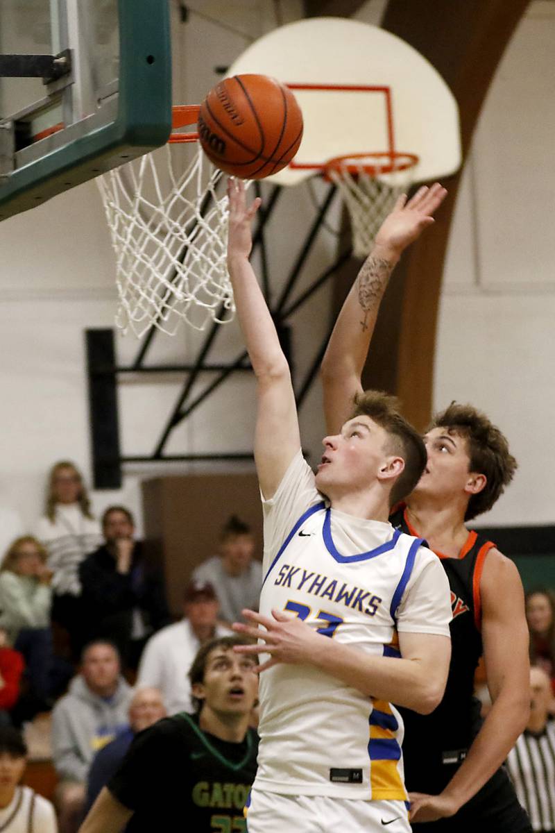Johnsburg's JT Schmitt drives to the basket in front of McHenry's Caleb Jett during the boy’s game of McHenry County Area All-Star Basketball Extravaganza on Sunday, April 13, 2025, at Alden-Hebron’s Tigard Gymnasium in Hebron.
