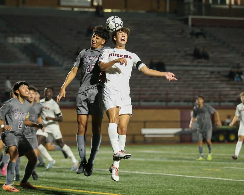 Morton's Christian Valadez (23) and Naperville North's Noah Radeke (7) heads the ball during soccer match between Naperville North at Morton.  Sept 21,