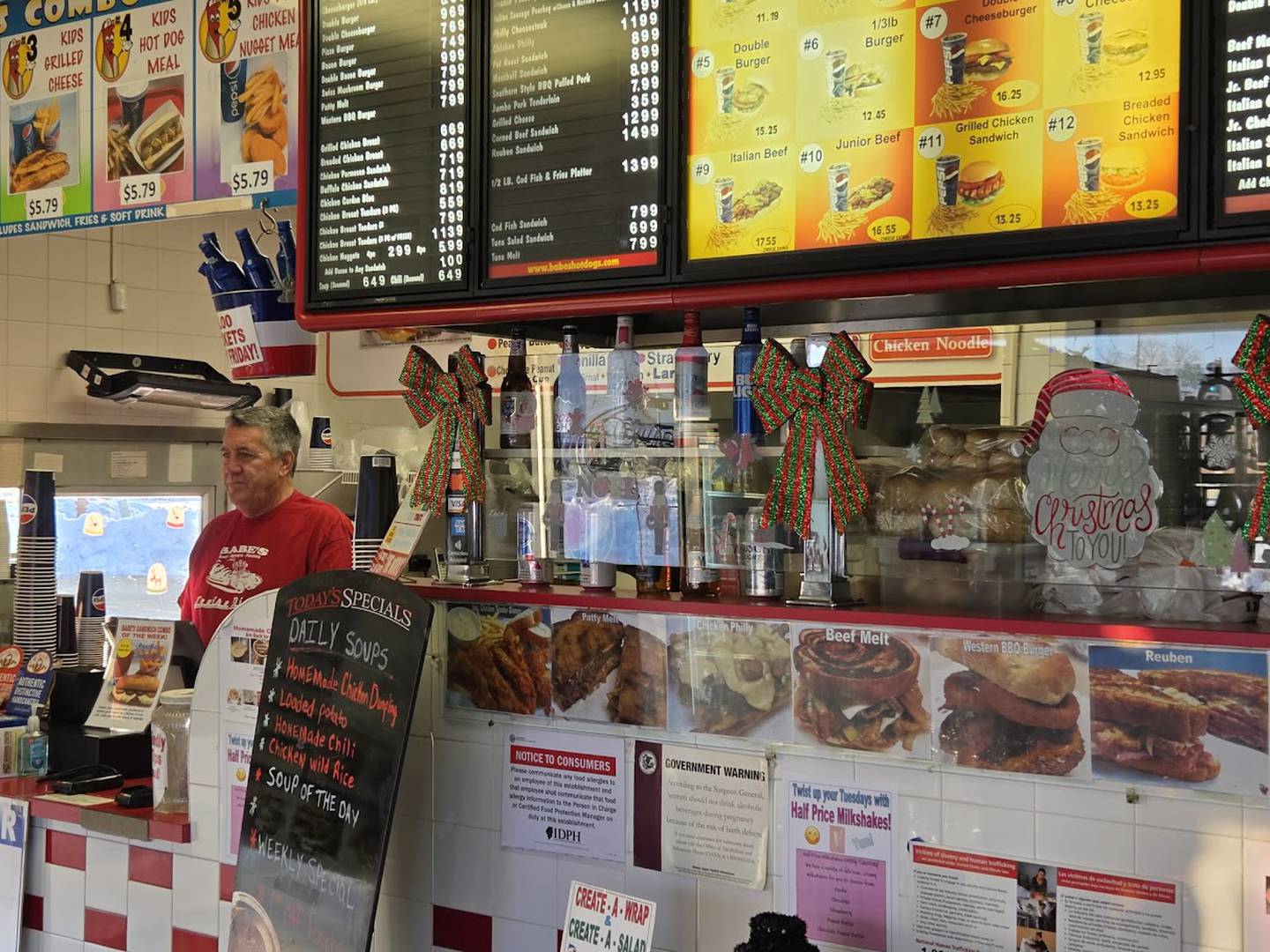 Tim Reilly, owner of Babe's Hot Dogs in Joliet, which he founded 37 years ago at the age of 25, is seen at the helm of his restaurant early on Tuesday, Dec. 9, 2025. Reilly has listed his business, which many consider a staple in the community, for sale.