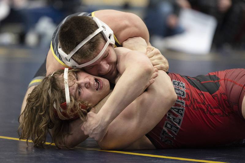 Michael Patrick of Galesburg works on pinning Streator’s Steven Goplin in the 160 pound third place match at the Sterling wrestling regional.