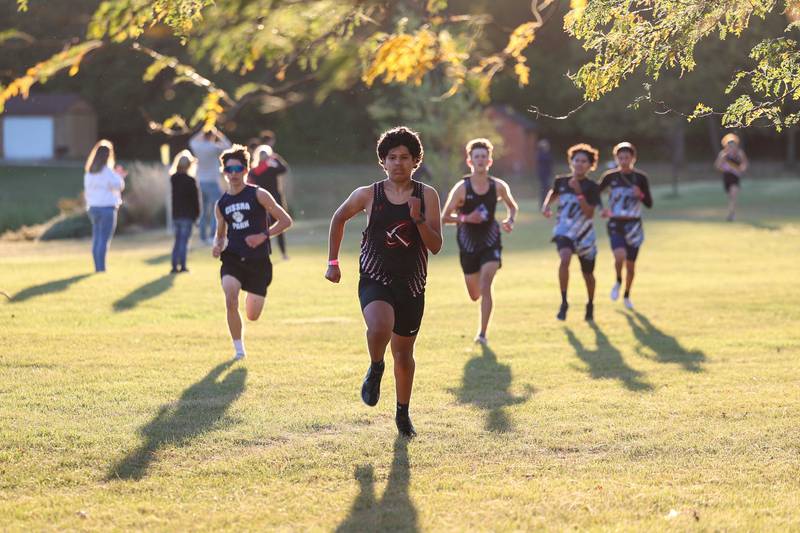 Bradley-Bourbonnais' Jaime Rodriguez Diaz fends off a handful of runners on the final stretch of the boys 3-mile race during All-Area Cross Country meet on Wednesday, Oct. 8, 2025, at Kankakee Community College.