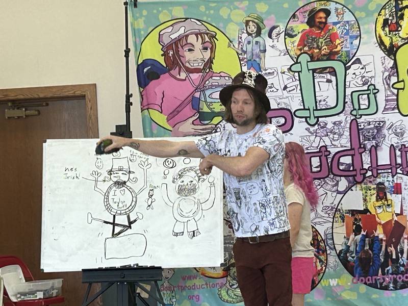 Jerry Moffitt inspires children's artistic creativity Friday at Odell Public Library in Morrison.