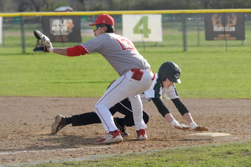 Rock Falls' Owen Laws dives safely back to first as Oregon's Nole Campos waits for the throw during a Monday, April 21, 2025 game at Oregon High School.