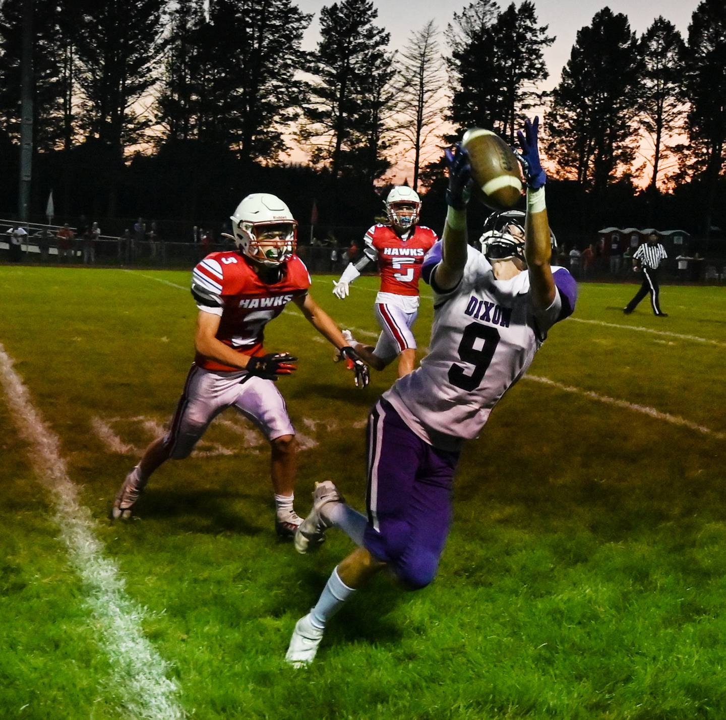 Dixon receiver Collin Scott has a pass slip from his grasp along the sideline while being defended by Oregon's Jayden Jenkins Friday, Aug. 26, 2022.
