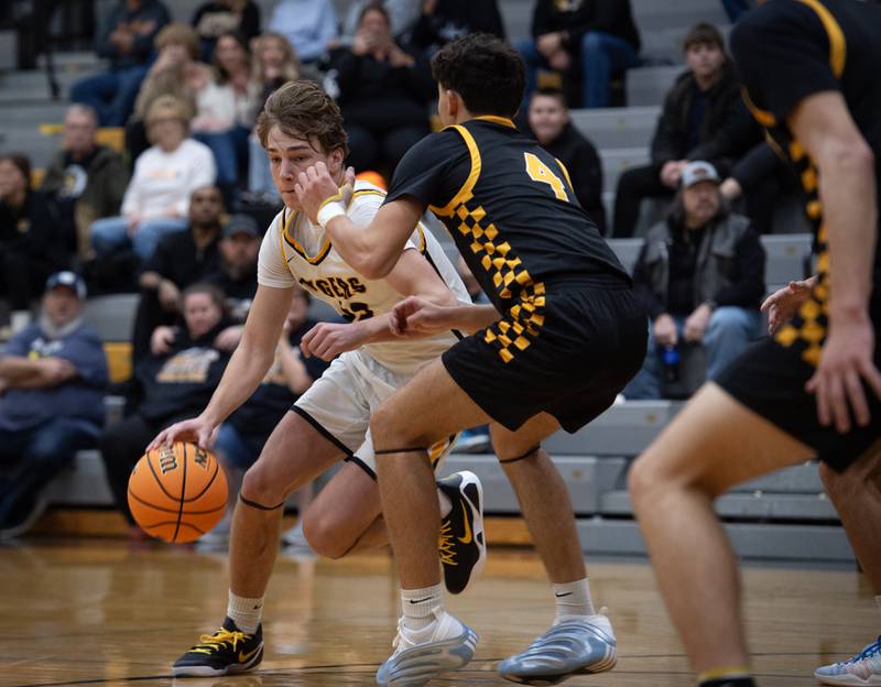 Herscher's Tyler Lundberg, left, controls the ball as Reed-Custer's Chase Isaac, right, defends in a game on Wednesday, November 26, 2025.