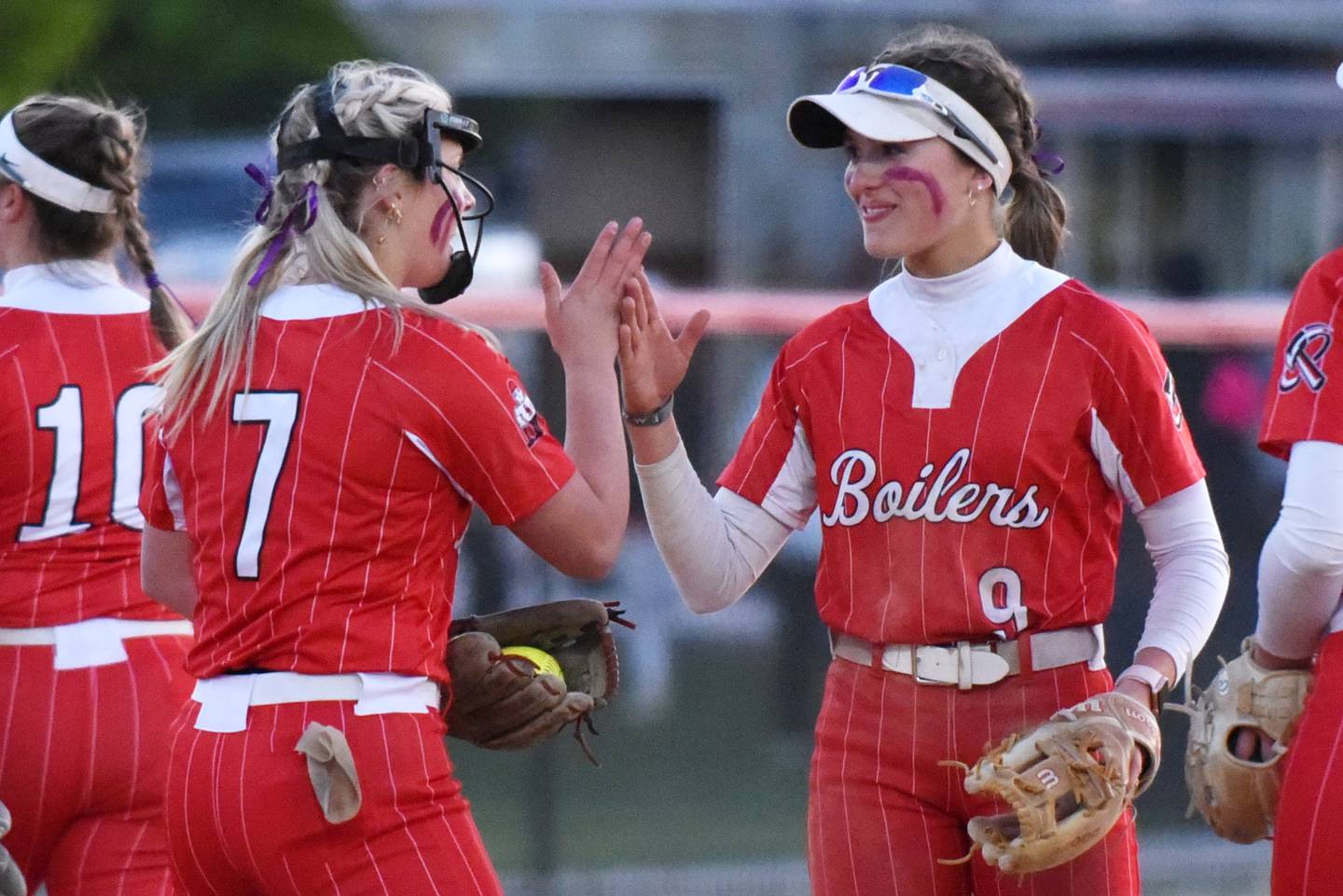 Bradley-Bourbonnais' Shannon Lee, right, does a celebratory handshake with Lydia Hammond during the Boilermakers' home game against Bishop McNamara Thursday, May 8, 2025.
