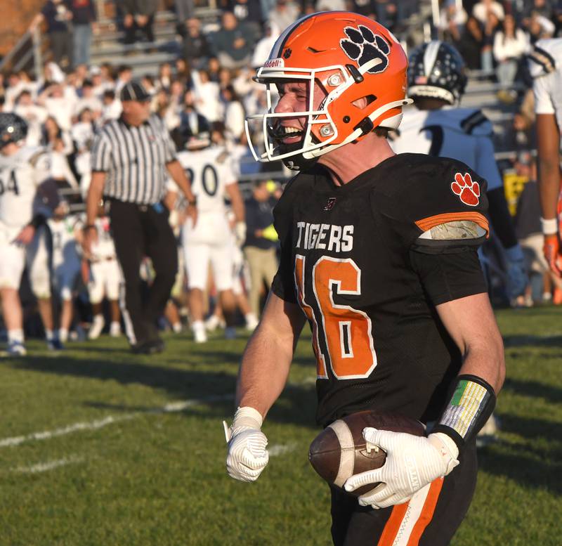 Byron's Andrew Talbert (16) reacts after intercepting a fourth quarter pass against  Elmhurst IC Catholic during a 3A quarterfinal game at Byron High School on Saturday, Nov. 15, 2025.