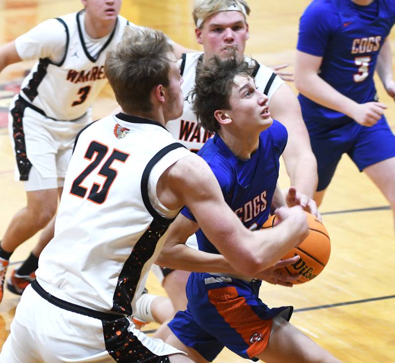 Genoa-Kingston's Kash Sunderlage (1) drives to the basket against Warren on Saturday, Dec. 13, 2025 at the 64th Annual Forreston Holiday Basketball Tournament held at Forreston High School.