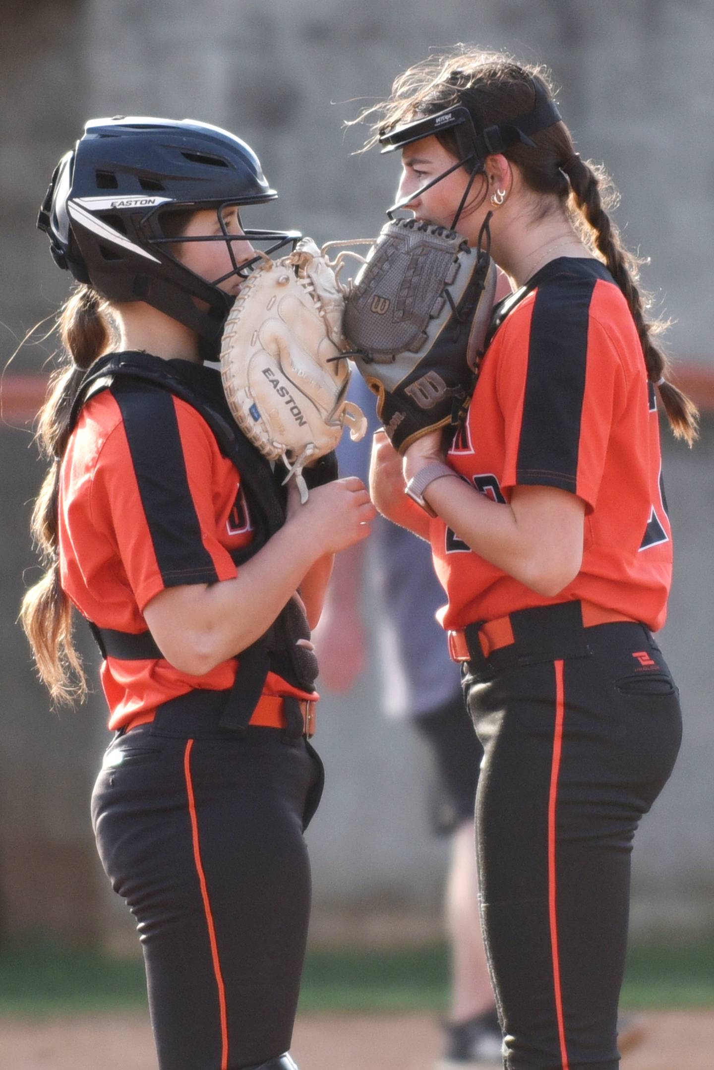 Beecher's Makenzie Johnson, left, and Taylor Norkus talk during a break in the action in a home game against Wilmington Thursday, April 24, 2025.