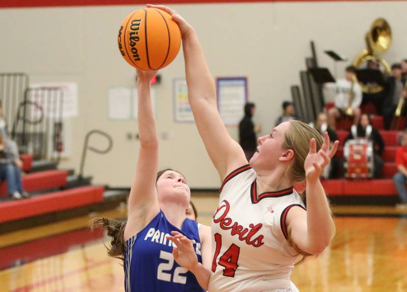 Hall's Ella Sterling blocks a shot by Princeton's Camryn Driscoll on Monday, Jan. 6, 2025 at Hall High School.