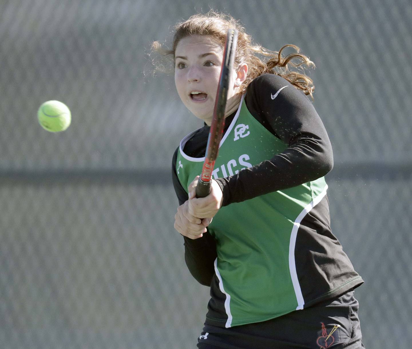 Providence Catholic's Emma Davis returns a shot as she plays Chicago University's Emma Baker in the 1A singles championship match at the IHSA State girls tennis finals at Buffalo Grove High School Saturday October 23, 2021.
