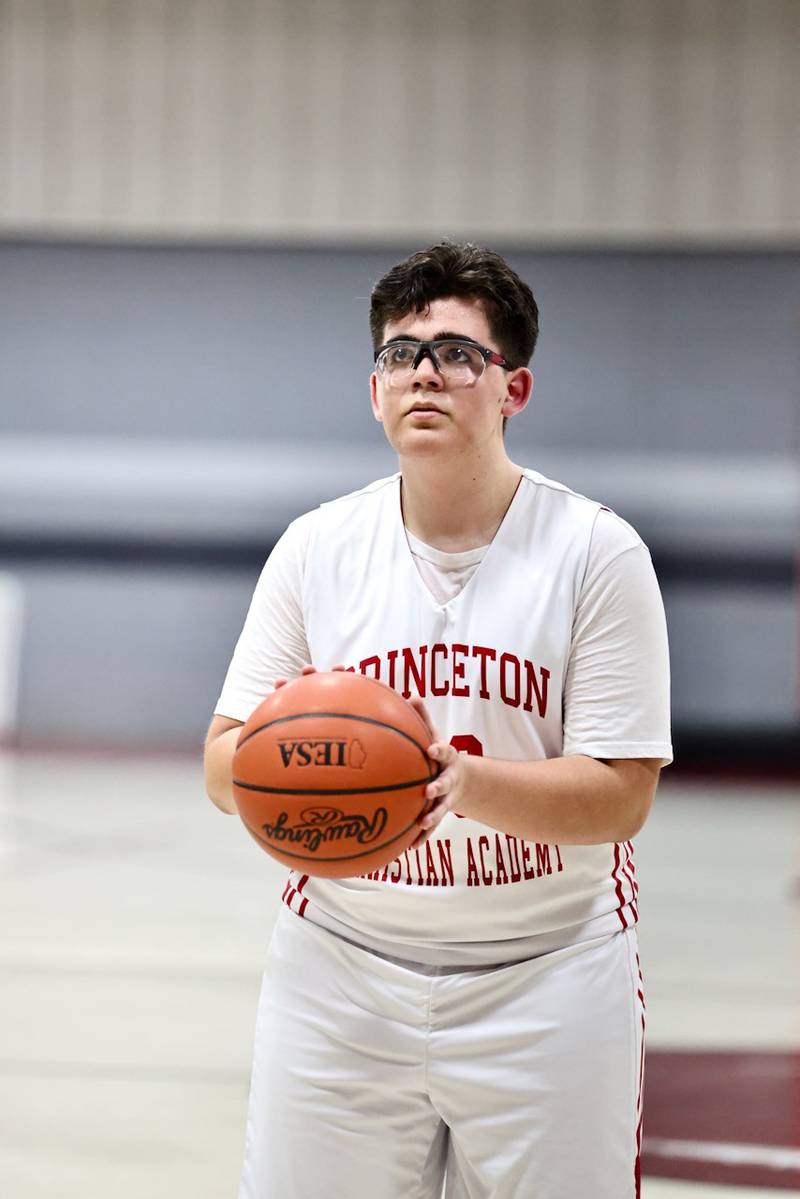PCA's Max Gibson shoots a first-half free throw in Thursday's JV game at PCA's Howard Hoffman Memorial Gymnasium. He also sang the National Anthem.