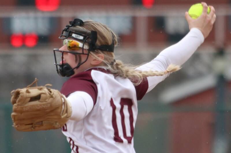 Marengo’s Lilly Kunzer makes an offering against Harvard in varsity softball at Marengo Thursday.