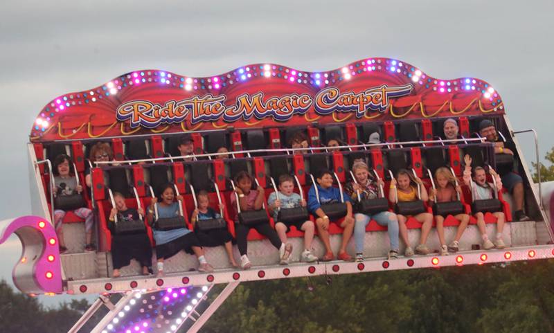 Kids ride the "Cliffhanger" ride during the 168th annual Bureau County Fair on Saturday, Aug. 26, 2023 in Princeton.