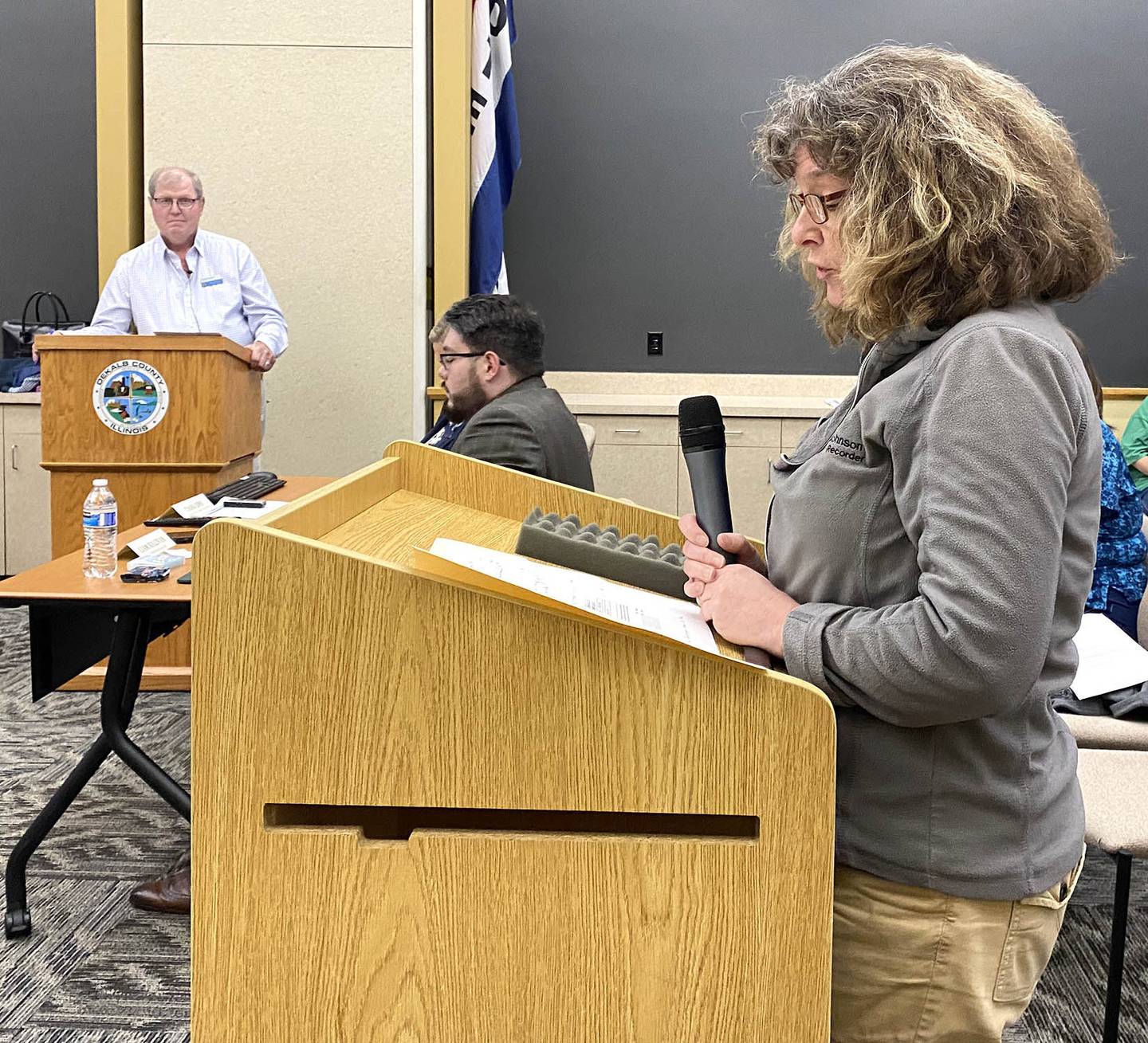 Diane Chappell, a county employee in the DeKalb County Clerk & Recorder's Office,  asks the DeKalb County Board not to sell the DeKalb County Rehabilitation and Nursing Center, where Chappell's mother has lived for the past nearly seven years, during a Committee of the Whole meeting Wednesday, June 8, 2022. Chairman John Frieders (left) looks on.