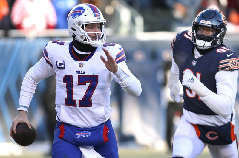 Buffalo Bills quarterback Josh Allen gets outside of the Chicago Bears defense for a touchdown during their game Sunday, Dec. 24, 2022, at Soldier Field in Chicago.