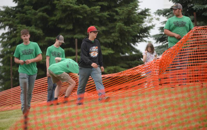 Volunteers work on taking down a fence after the Forreston FFA Alumni Tractor and Truck Pull held during Leaf River Daze in Leaf River on Saturday, June 7, 2025. The event was held on the lawn southeast of the River Valley Complex.