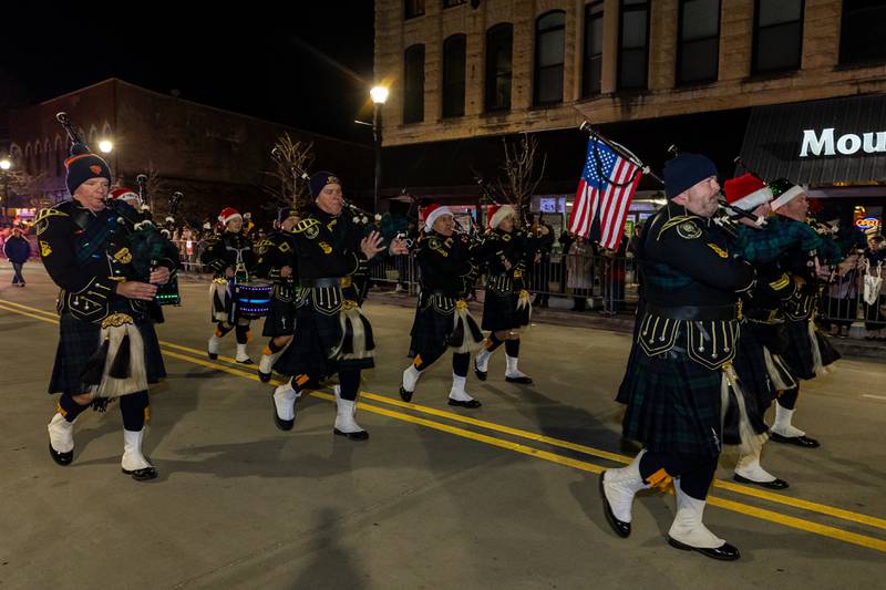 Bagpipers perform as the Light Up the Holidays Parade moves down Chicago Street in Joliet on Nov. 28, 2025.