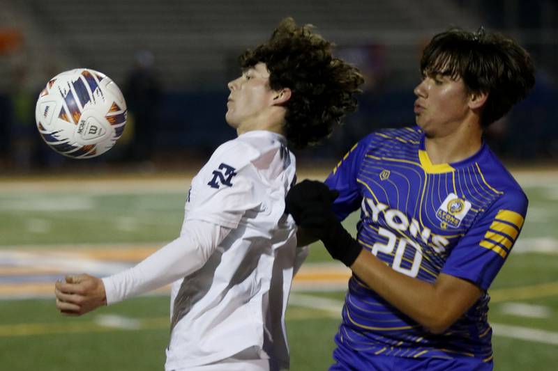 New Trier's Calyx Hoover controls the ball in front of Lyons Township's Mason Santos during the IHSA Class 3A state championship soccer match on Saturday, Nov. 4, 2023, at Hoffman Estates High School.