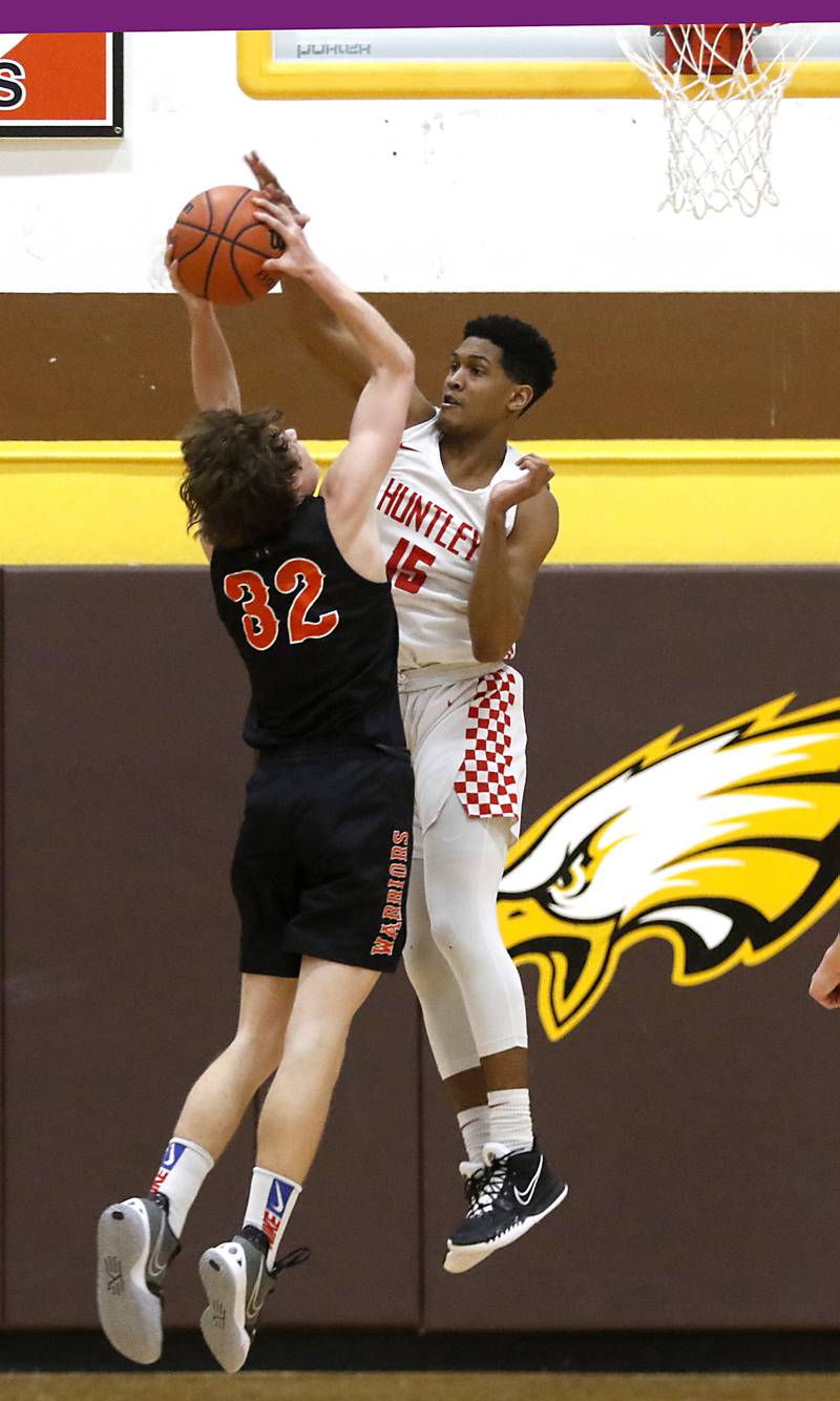 Huntley's Noah Only, right, tries to block the shot of McHenry’s Anthony Fowler during a IHSA Class 4A Boys Regional basketball game Wednesday, Feb. 23, 2022, between Huntley and McHenry at Jacobs High School.