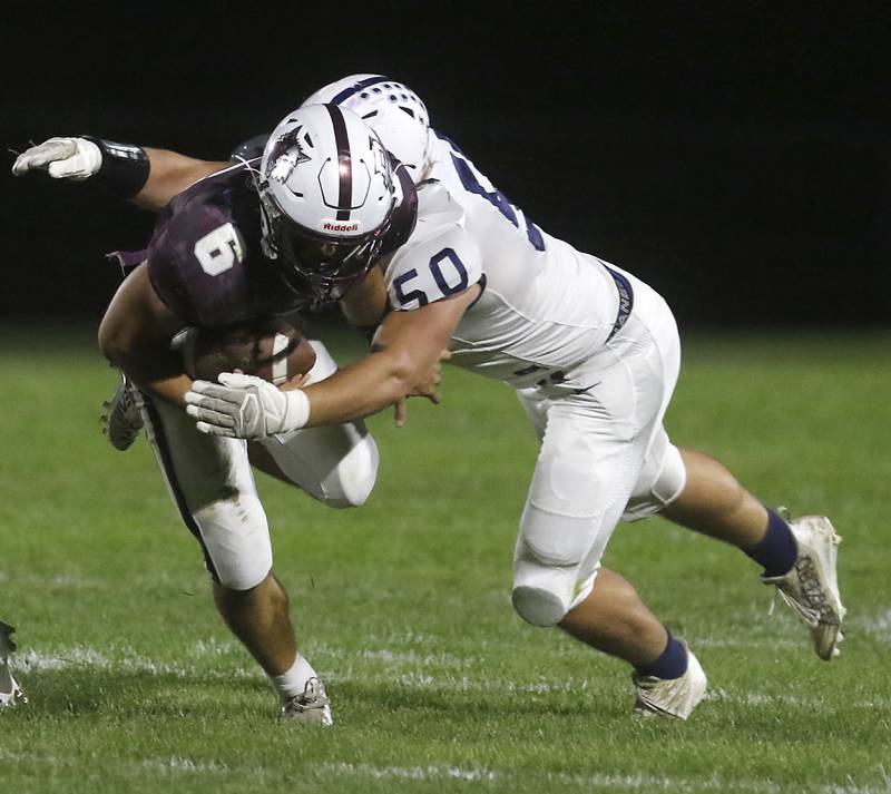 Prairie Ridge's Luke Vanderwiel is tackled by Cary-Grove's Ty Drayton during a Fox Valley Conference football game on Friday, Sept. 27, 2024, at Prairie Ridge High School.