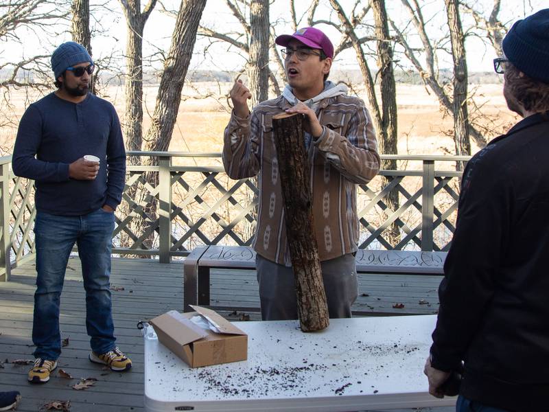 Trickster Cultural Center Program Manager Tristan Podlasek teaches attendees about making cordage from a log during the Welcome Winter Celebration on Saturday, Dec. 28, 2024, at the Lost Valley Visitor Center in Ringwood. Wood cordage was traditionally used by indigenous people for a variety of things, including clothing.