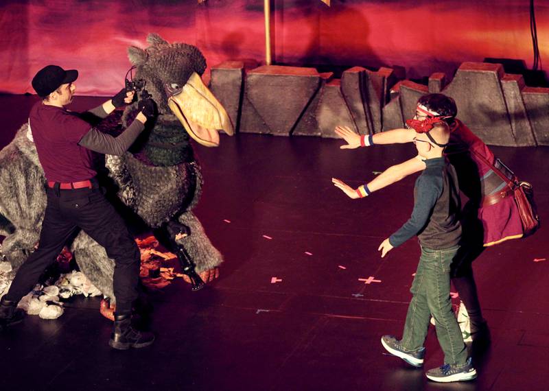 A member of the audience joins Dave the Hero Trainer as they attempt to trick the garbage-loving griffin so they can sneak into its nest to obtain a gold key as part of "Dragons and Mythical Beasts" which made two performances Saturday, Feb. 11, 2023 at Dixon Theatre.