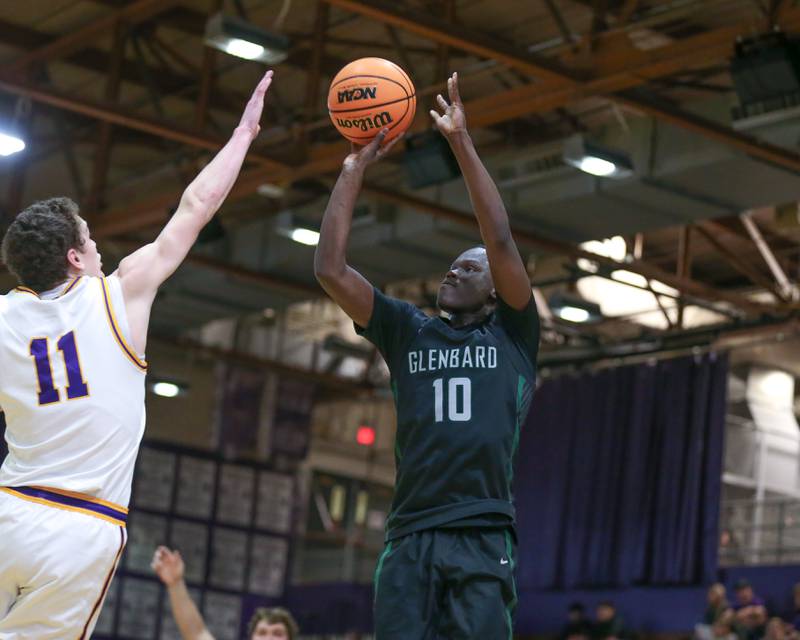 Glenbard West's Josh Abushanab (10) shoots a jumper during their basketball game between Glenbard West at Downers Grove North. Jan 24, 2025 in Downers Grove.