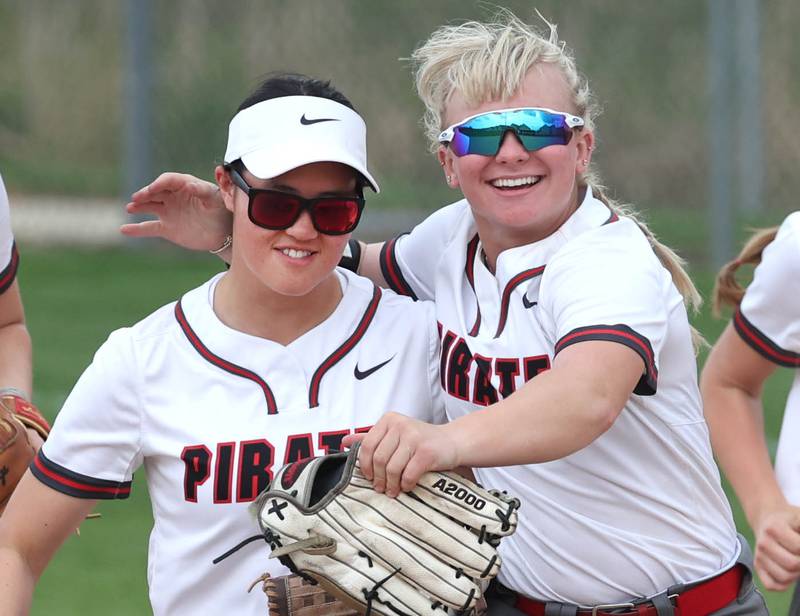 Ottawa’s Zulee Moreland (left) is congratulated after a big catch by teammate Reese Purcell during their game against Sycamore Thursday, May 2, 2024, at Sycamore High School.