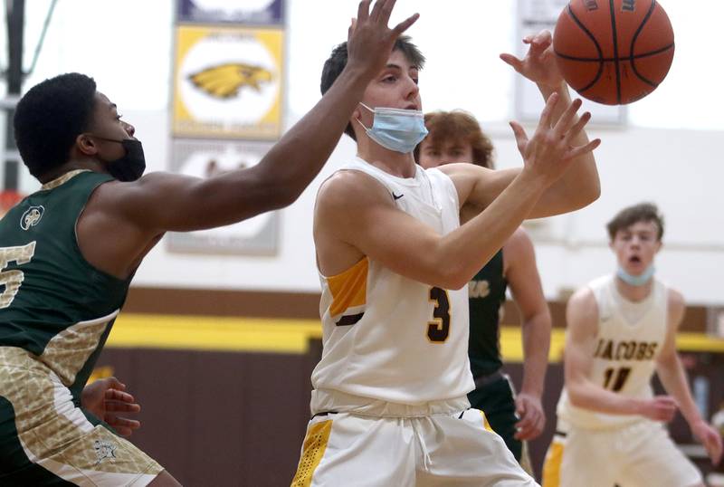 Jacobs’ Jack Bonkoski corrals the ball during boys varsity basketball against Rockford Boylan at Algonquin Saturday afternoon.