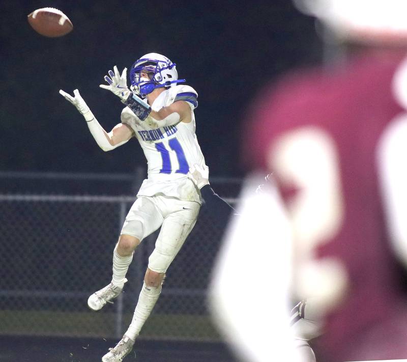 Vernon Hills’ Devin Ratajczyk reels in a pass in IHSA football Class 5A first-round playoff action at Prairie Ridge High School in Crystal Lake on Friday, October 31, 2025.