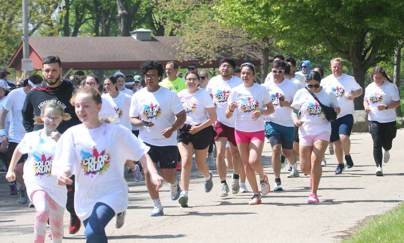 Runners begin to race during the Color Fun Run on Sunday, April 26, 2026 at Lake Mendota.