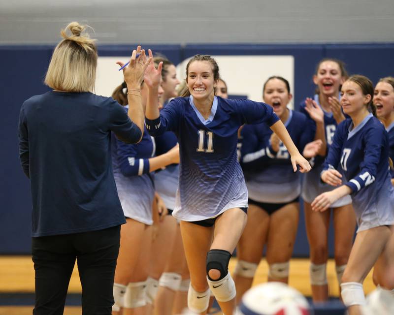 Nazareth's Tori Sarin (11) runs out during pregame introductions before their match at IC Catholic Prep.  Aug 29, 2023.