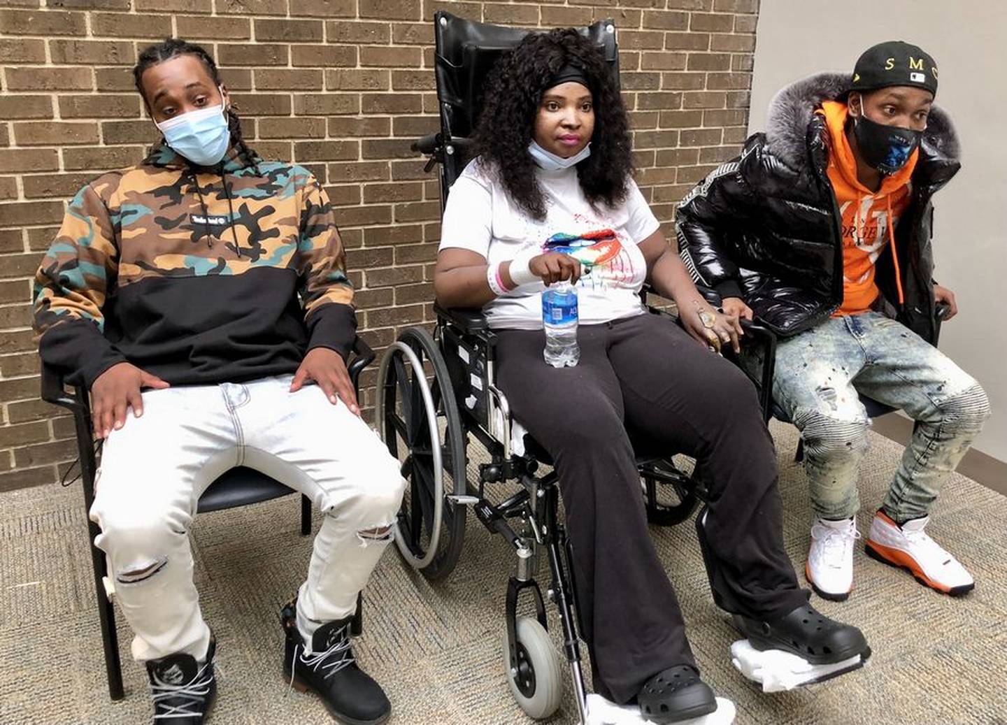 Shaquita Slaughter left Advocate Lutheran General Hospital, with her brothers Princeton Carter, right, and Pierre Carter, after a long battle with COVID-19.