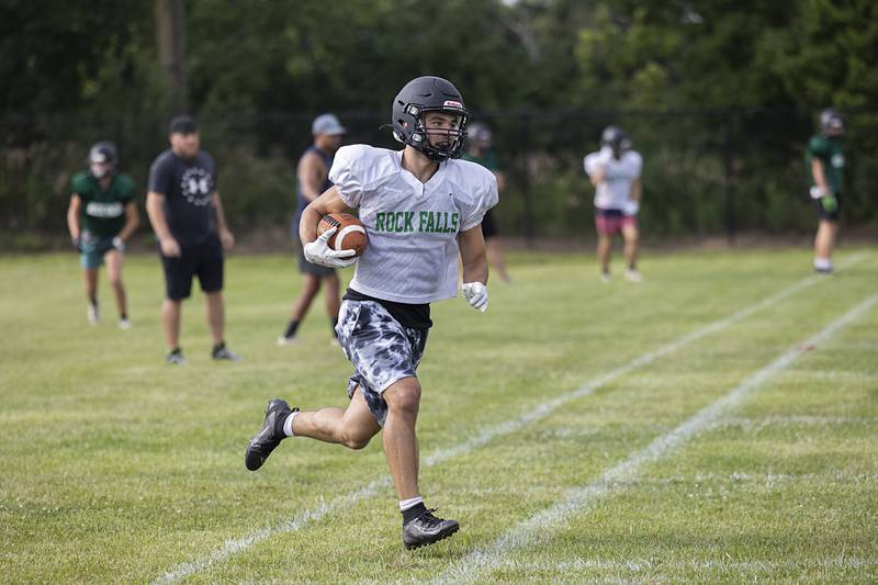 Issac Duchy turns upfield after a catch Tuesday, July 16, 2024, during drills at Rock Falls football camp.