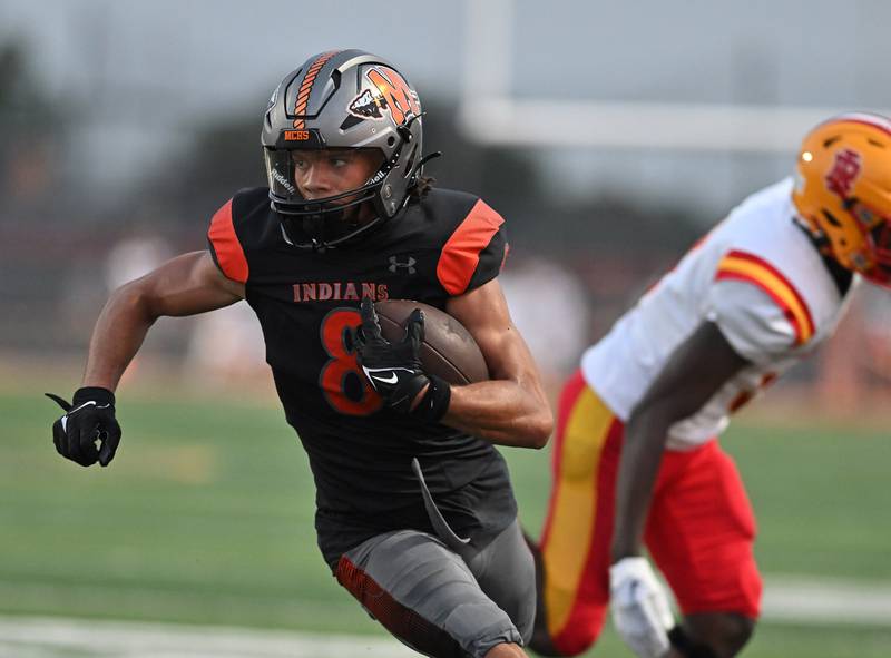 Minooka's Kameron Hopkins runs for a touchdown during a non-conference game against Rock Island on Friday, Aug. 25, 2023, at Minooka. (Dean Reid for Shaw Local News Network)