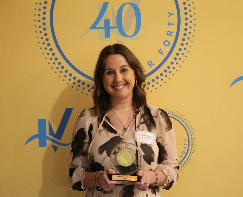 Megan Theisinger poses for a photo with his award during the 40 Under Forty awards banquet on Thursday, March 21, 2024 at Westclox in Peru.
