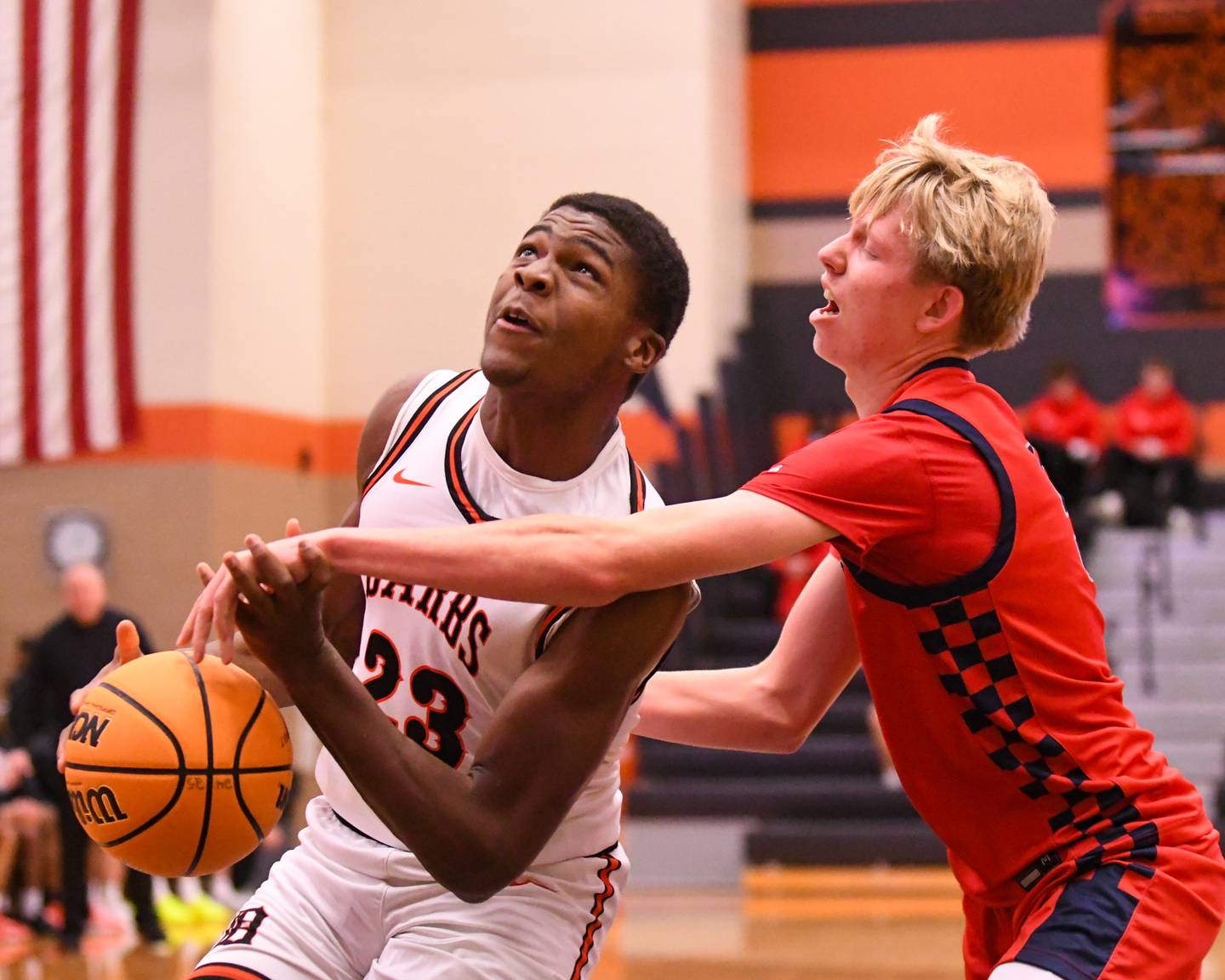 DeKalb's Davon Grant (23) gets his shot blocked by Belvidere North's Brayden Lewis (5) during the game on Friday Dec. 27, 2024, during the 97th Chuck Dayton Classic Basketball tournament held in DeKalb.