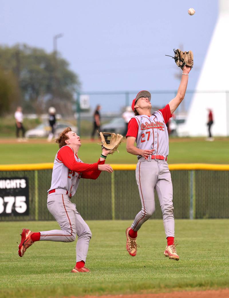 LaSalle-Peru's Grey Ernat makes a catch as Ceyton Urbanski backs him up Tuesday, May 12, 2026, during their game at Kaneland High School in Maple Park.