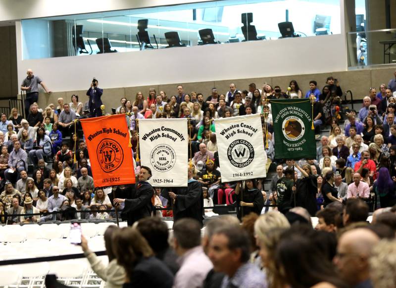 Flag bearers enter the facility during the Wheaton Warrenville South commencement ceremony on Saturday, May 24, 2025 at the College of DuPage in Glen Ellyn.