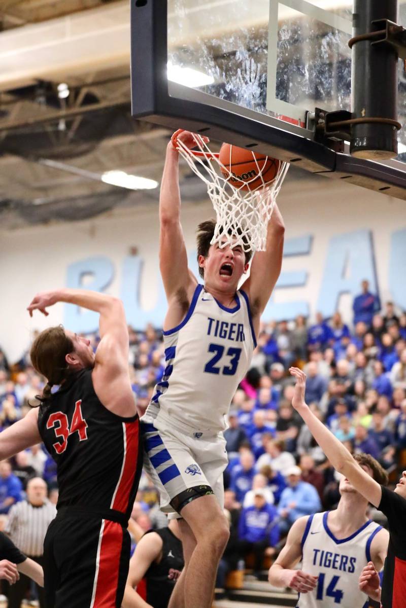 Princeton sophomore Noah LaPorte throws down a dunk in the third quarter of Friday's regional championship game at the Storm Cellar. The Tigers defeated Stillman Valley, 68-37, to repeat as regional champions.