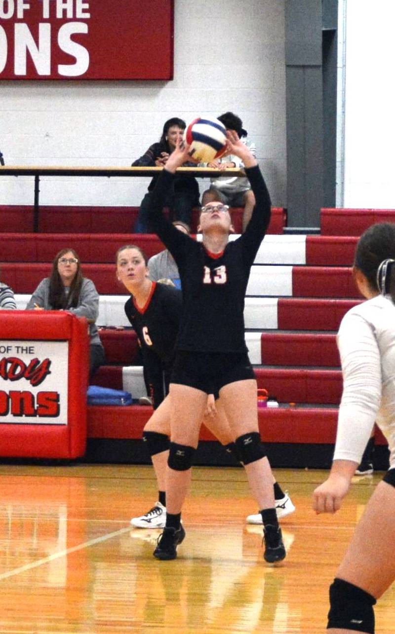 LaMoille's Olivia Williams sets against Hiawatha Tuesday at Dean Madsen Gymnasium at LaMoille.