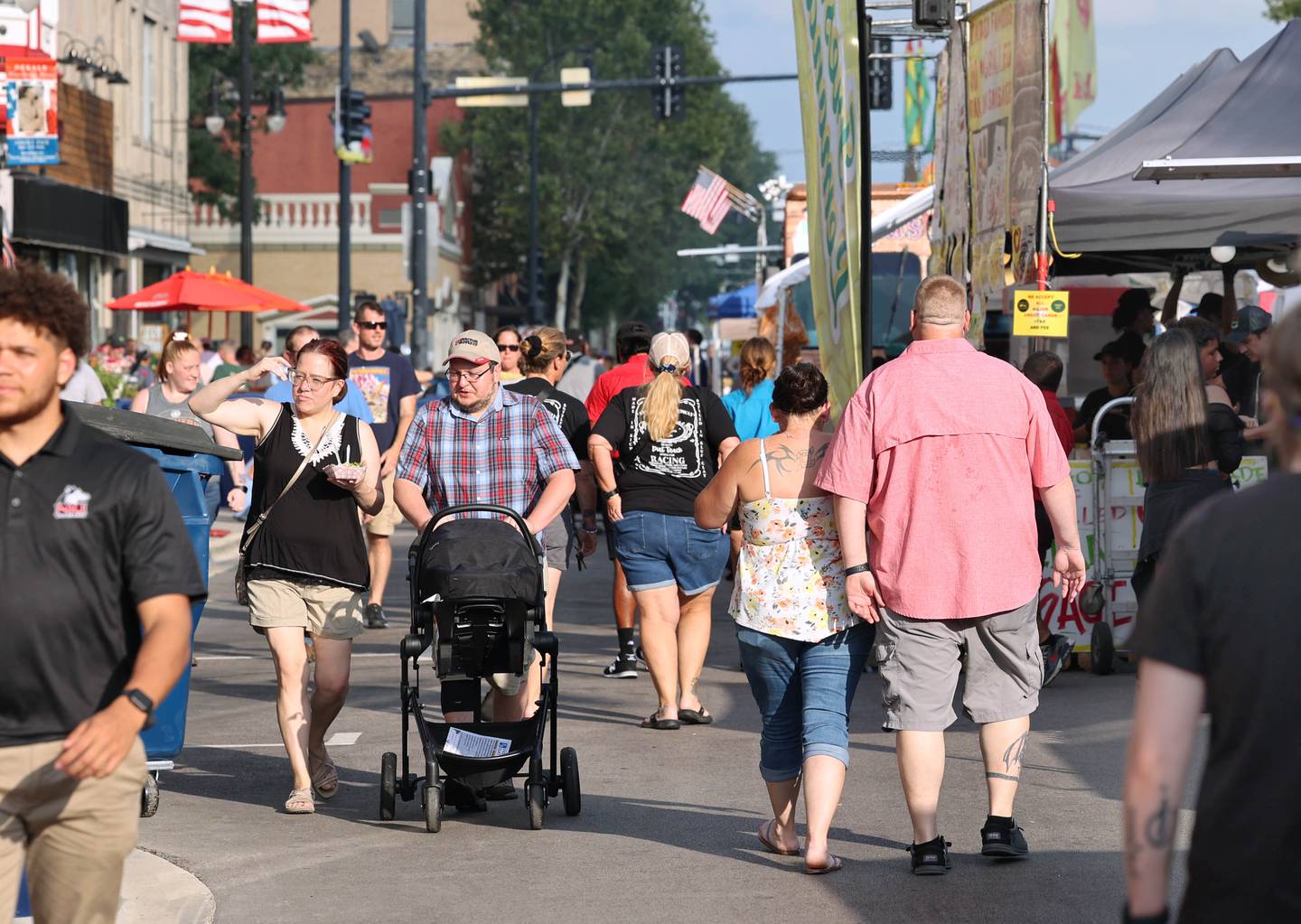 Crowds head down Lincoln Highway Friday, Aug. 25, 2023, during Corn Fest in downtown DeKalb.