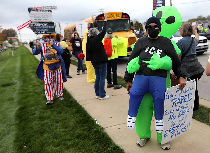 Protesters line Route 31 during a "No Kings” protest rally on Saturday, Oct. 18, 2025, in McHenry. The protest drew thousands of protesters to the area to protest the policies of President Donald Trump.